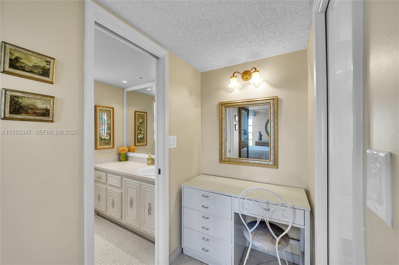 2681 South Course Drive, Unit 912 Pompano Beach, FL 33069 - Photo 19 of 44 a bathroom with a sink a mirror and a window