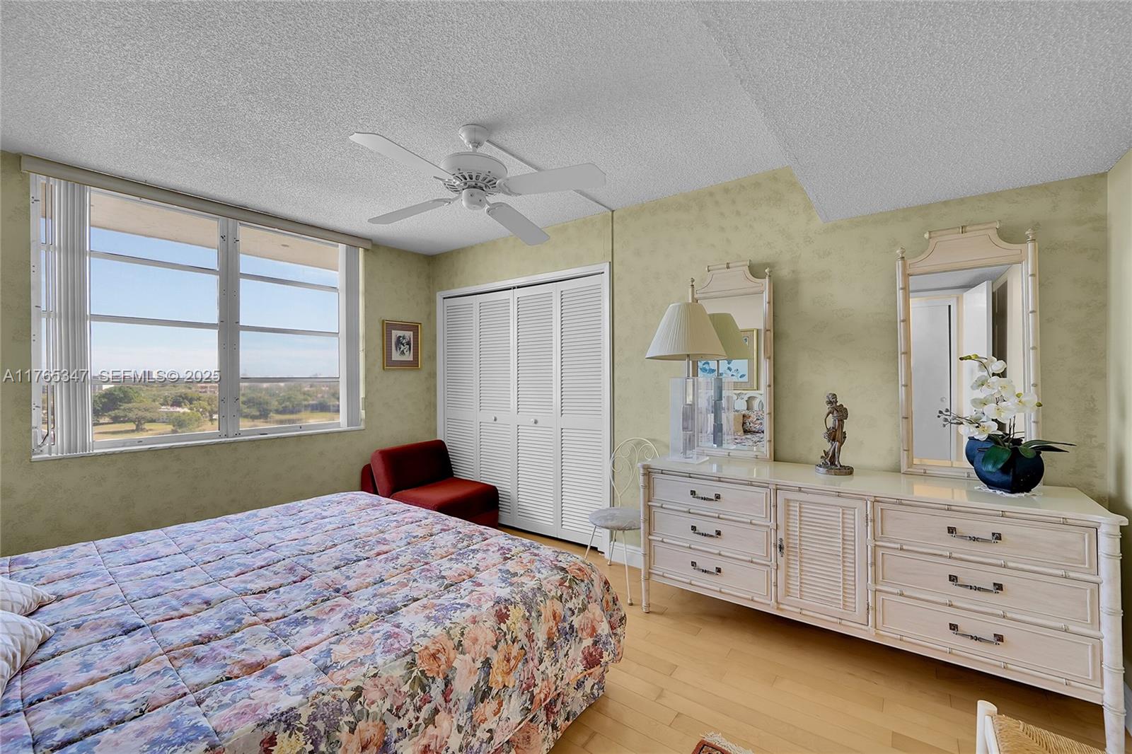 2681 South Course Drive, Unit 912 Pompano Beach, FL 33069 - Photo 21 of 44 a bedroom with a bed and a window