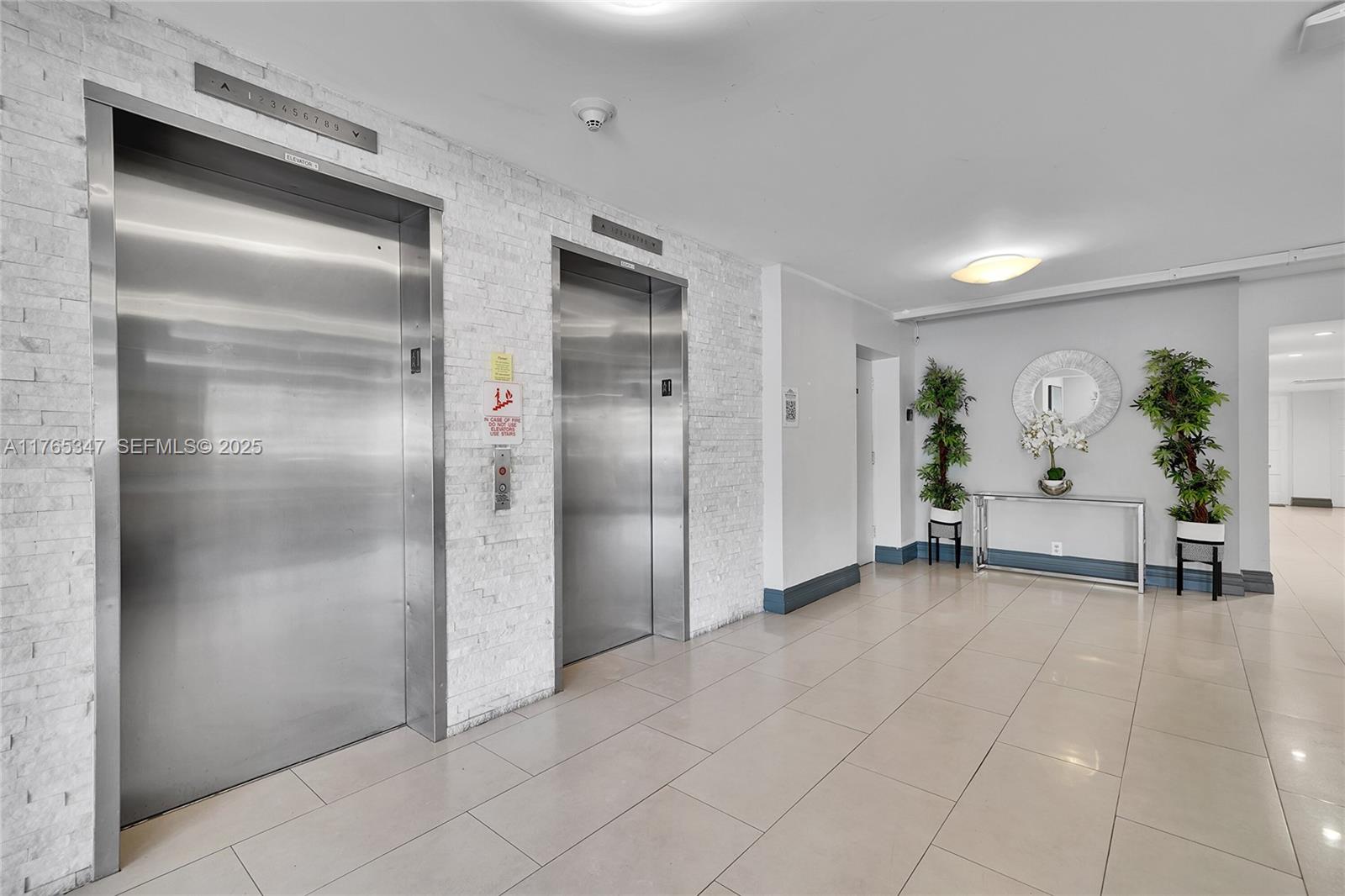 2681 South Course Drive, Unit 912 Pompano Beach, FL 33069 - Photo 26 of 44 a view of a hallway with closet area