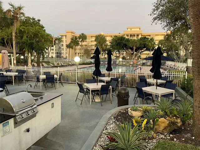 a view of a swimming pool with a patio
