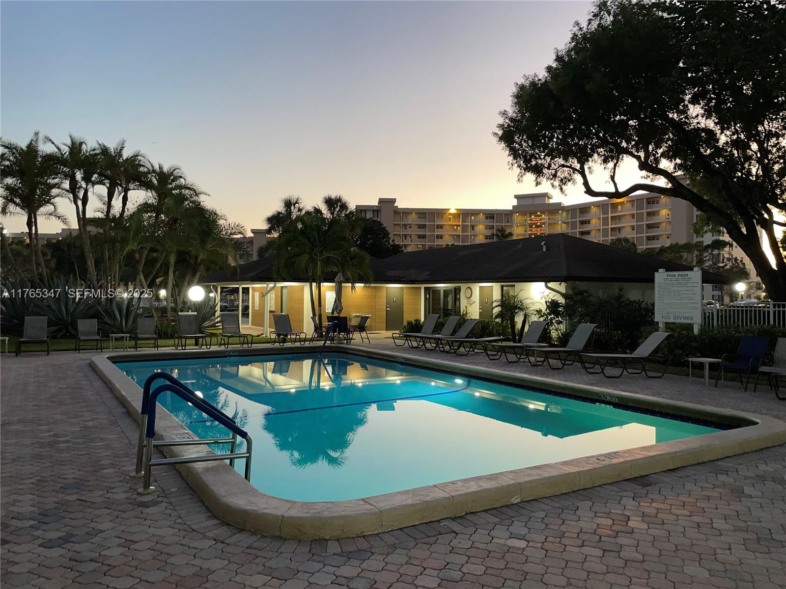 2681 South Course Drive, Unit 912 Pompano Beach, FL 33069 - Photo 36 of 44 a view of swimming pool having outdoor seating