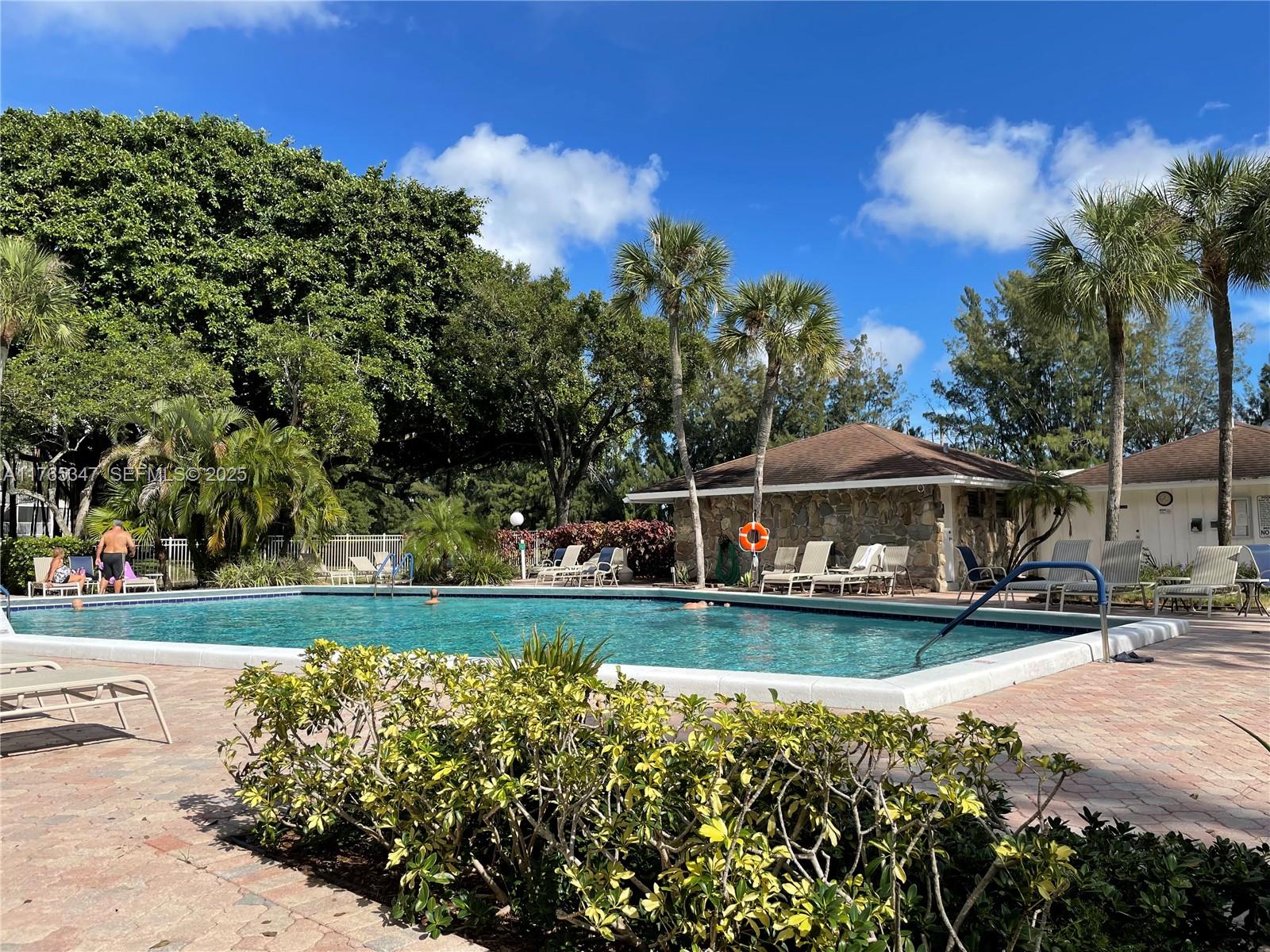 2681 South Course Drive, Unit 912 Pompano Beach, FL 33069 - Photo 39 of 44 front view of a house with a yard