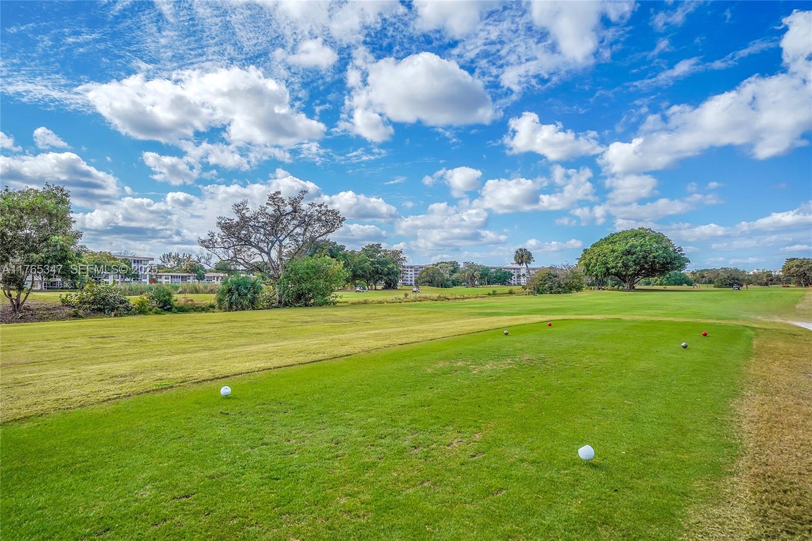 2681 South Course Drive, Unit 912 Pompano Beach, FL 33069 - Photo 40 of 44 a view of an ocean yard and outdoor seating