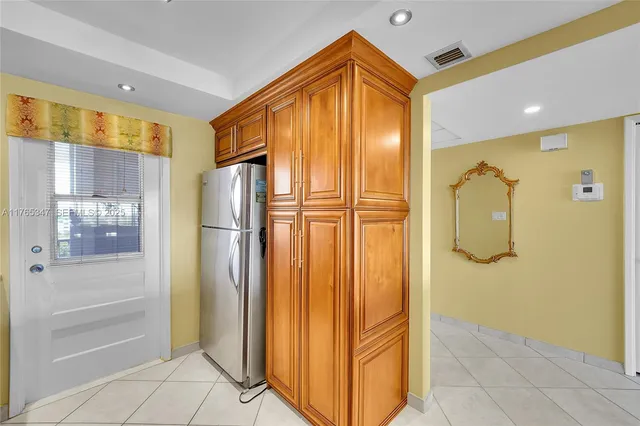 a bathroom with a shower and a glass door