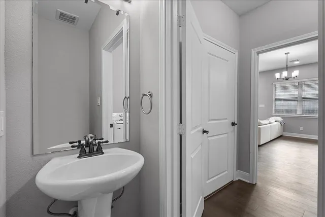 a bathroom with a sink a mirror and a toilet