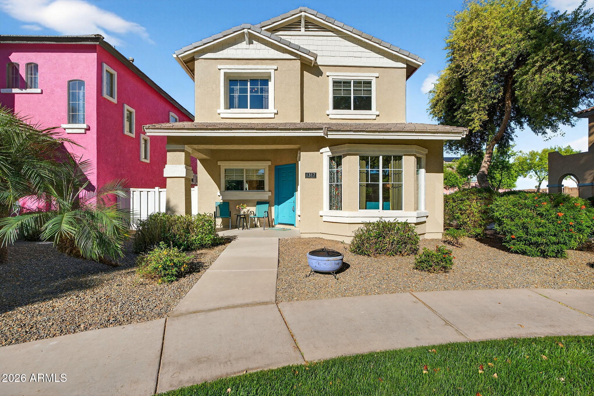 1317 South Banning Street Gilbert, AZ 85296 - Photo 1 of 46 a front view of a house with a yard