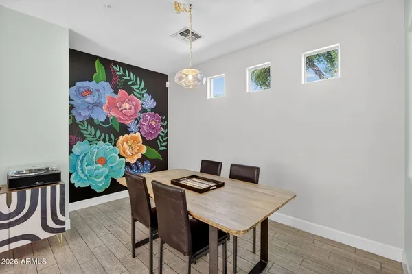 a view of a dining room with furniture and wooden floor