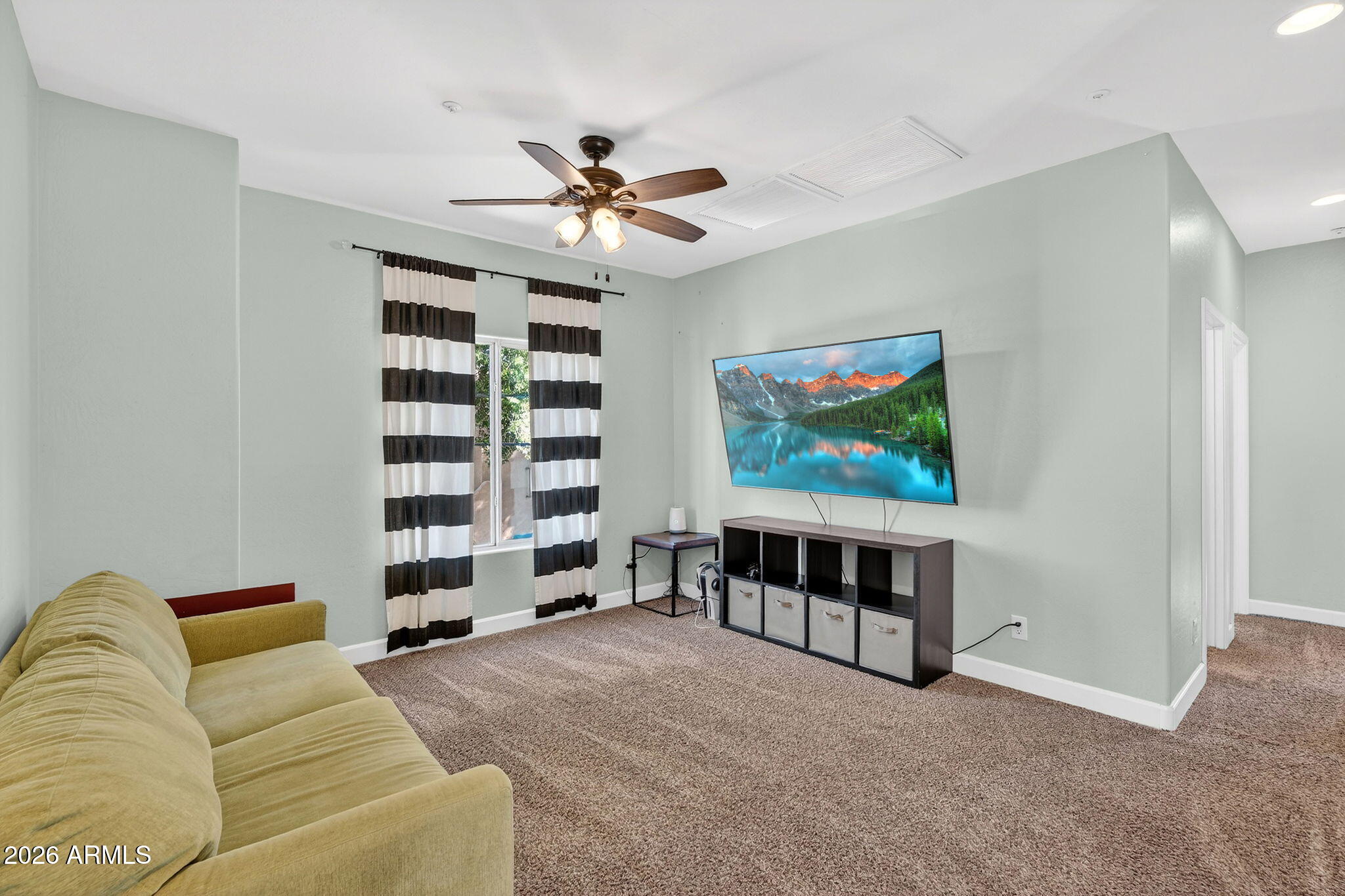 1317 South Banning Street Gilbert, AZ 85296 - Photo 16 of 46 a living room with furniture and a flat screen tv