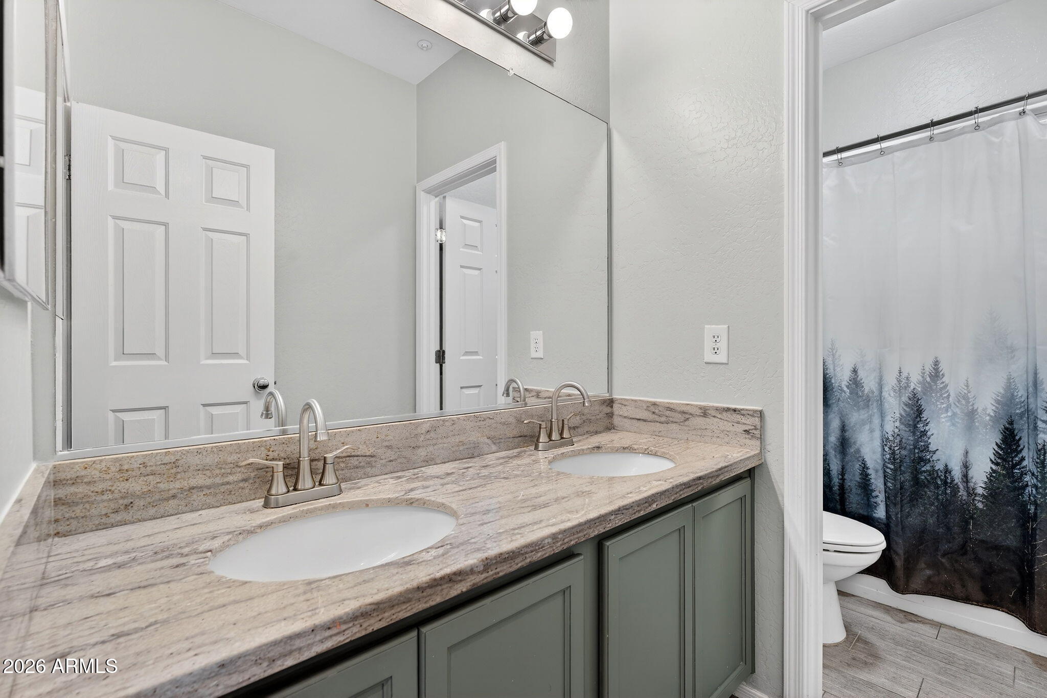 1317 South Banning Street Gilbert, AZ 85296 - Photo 26 of 46 a bathroom with a granite countertop sink and a mirror