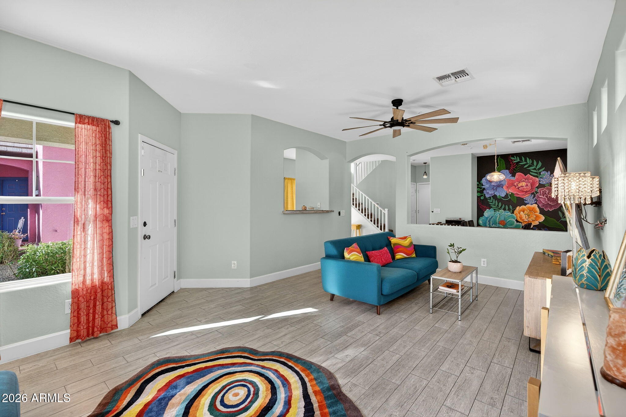 1317 South Banning Street Gilbert, AZ 85296 - Photo 3 of 46 a living room with furniture and a flat screen tv