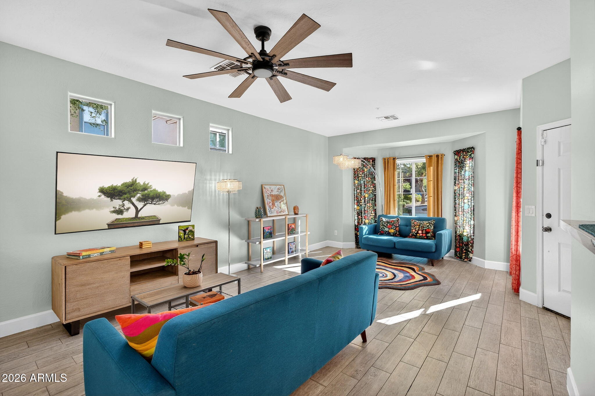 1317 South Banning Street Gilbert, AZ 85296 - Photo 5 of 46 a living room with furniture and a flat screen tv