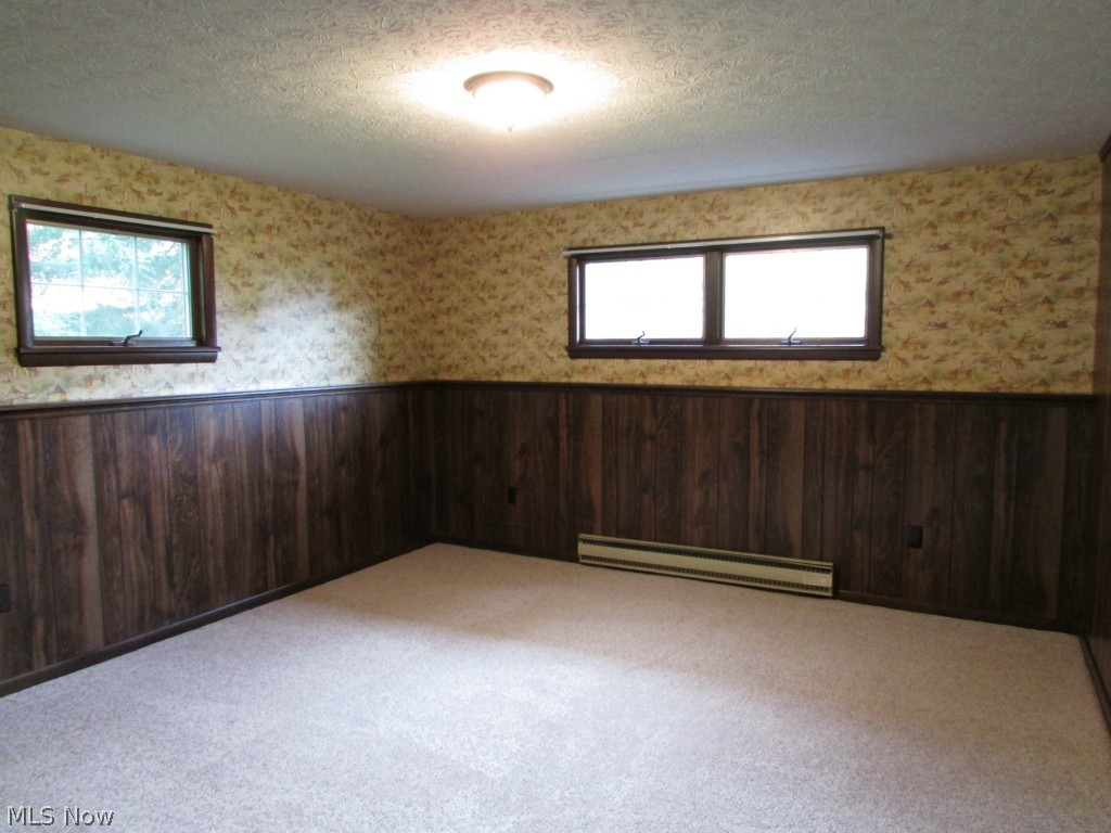 12044 Huntoon Road Painesville, OH 44077 - Photo 19 of 25 This lower level room could be utilized as a 5th bedroom, office or den. It has ample windows and a generous closet.