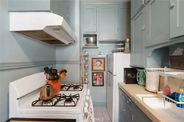 a kitchen with stainless steel appliances granite countertop a sink and cabinets