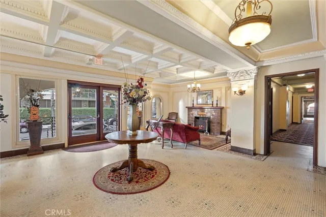 a living room with furniture and a chandelier