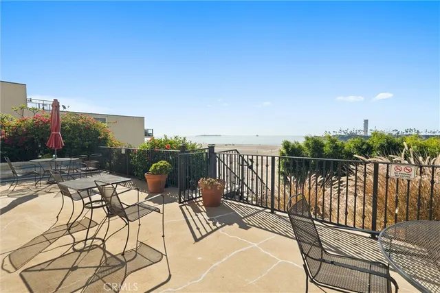 a view of a patio with two chairs and a table