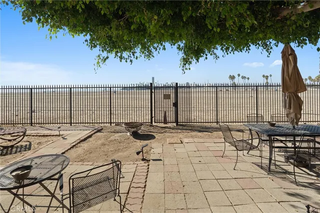 a view of an ocean with furniture