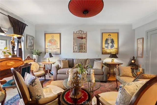 a living room with furniture a window and a lamp