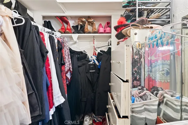 a view of a closet with storage