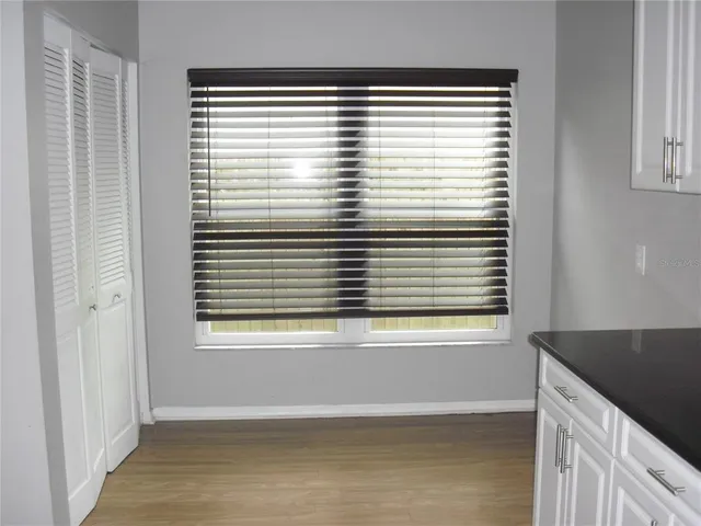 a view of an empty room with a large window