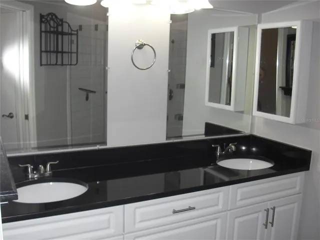 a white toilet sitting next to a sink