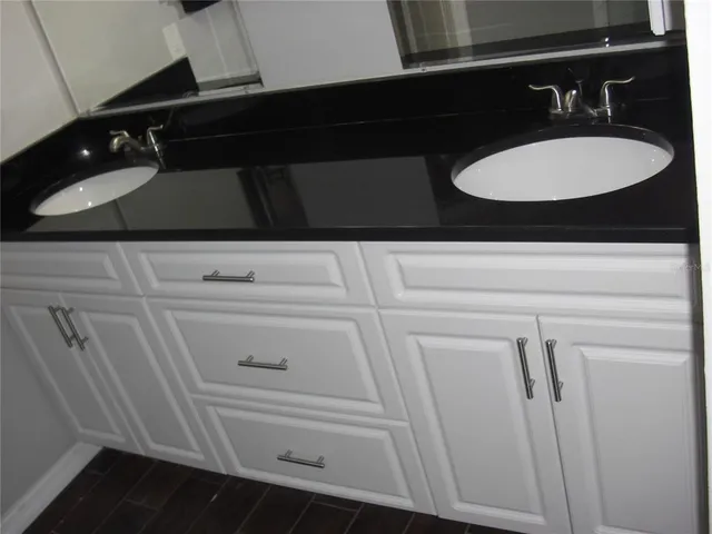 a bathroom with a glass shower door