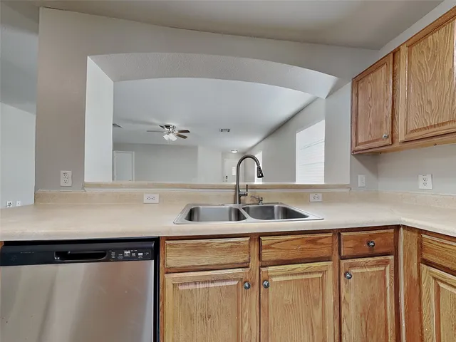 a kitchen with a sink and cabinets