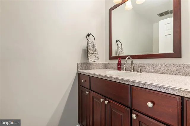 a view of a swimming pool with an outdoor space and seating area