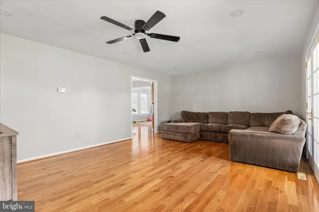 a kitchen with stainless steel appliances granite countertop a refrigerator a stove and a sink with cabinets