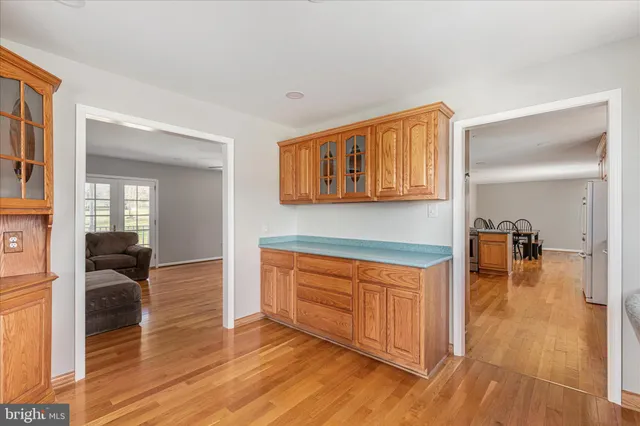 a view of an empty room and wooden floor