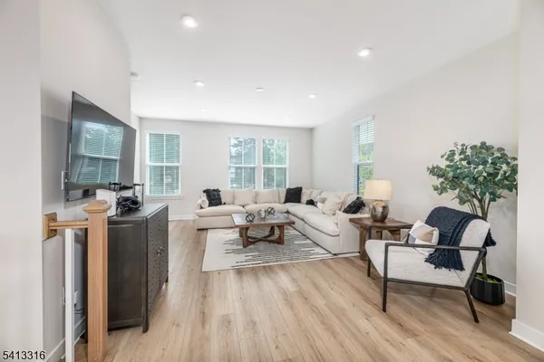 a living room with furniture and a table