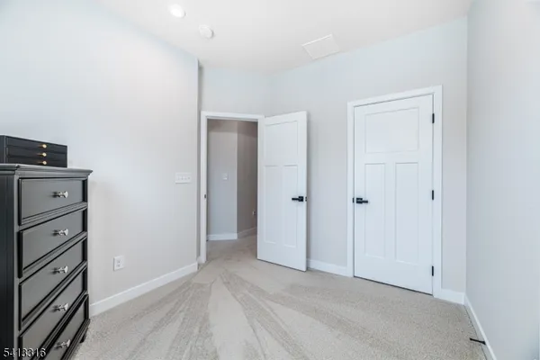 a view of room with walk in closet
