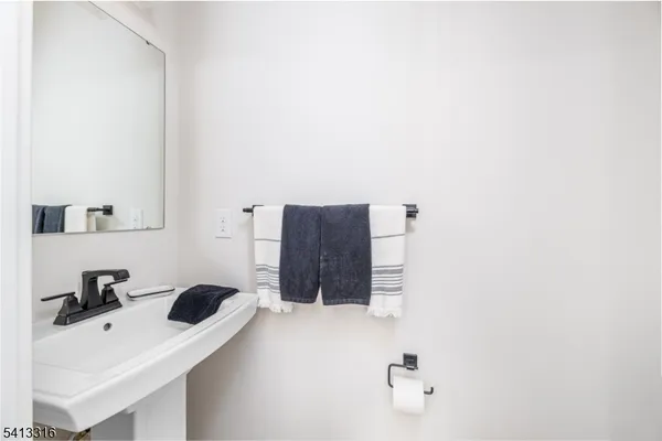 a view of a chair and table in the balcony