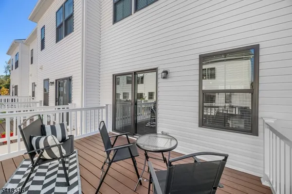a view of a balcony with furniture