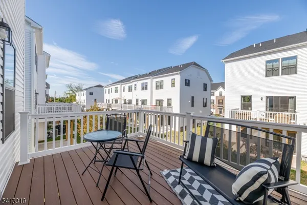 a view of an chairs and table in the patio