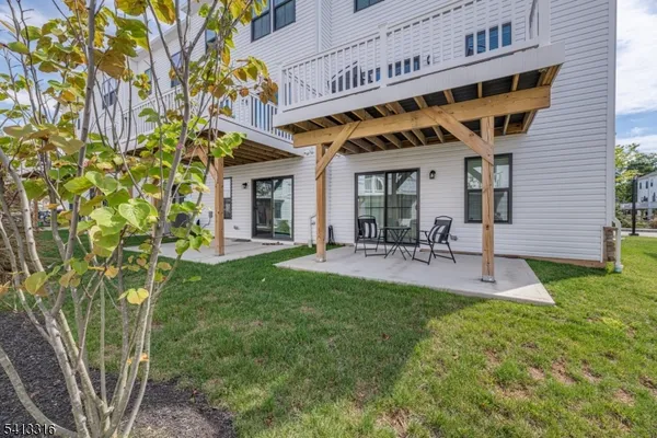a view of a house with a yard porch and sitting area