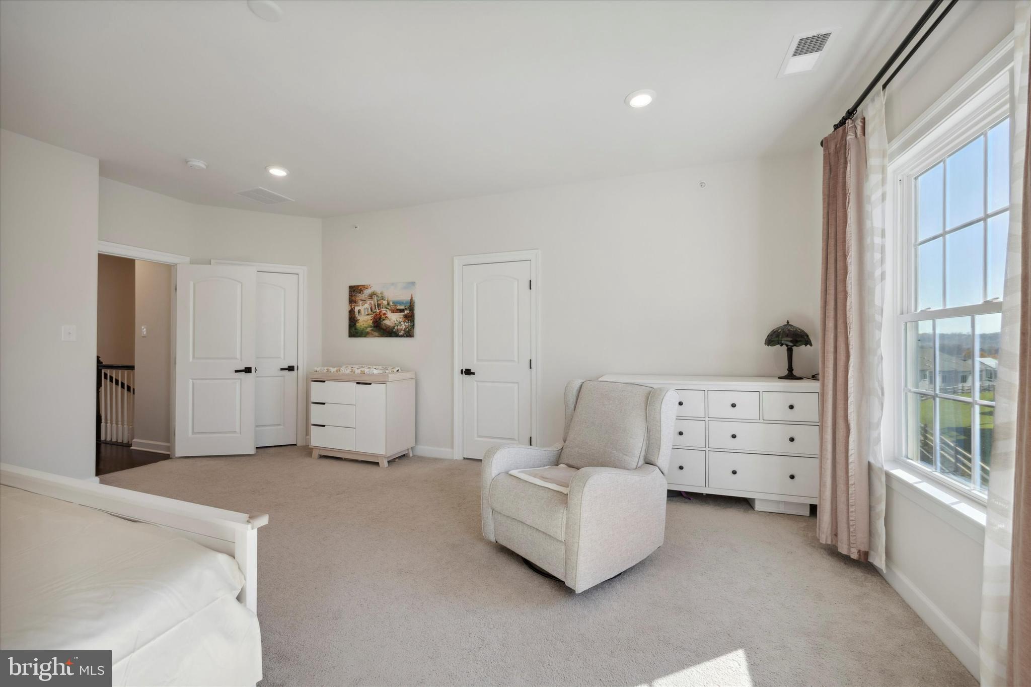 831 Stonecliffe Road Malvern, PA 19355 - Photo 15 of 32 a spacious bedroom with a bed and a window