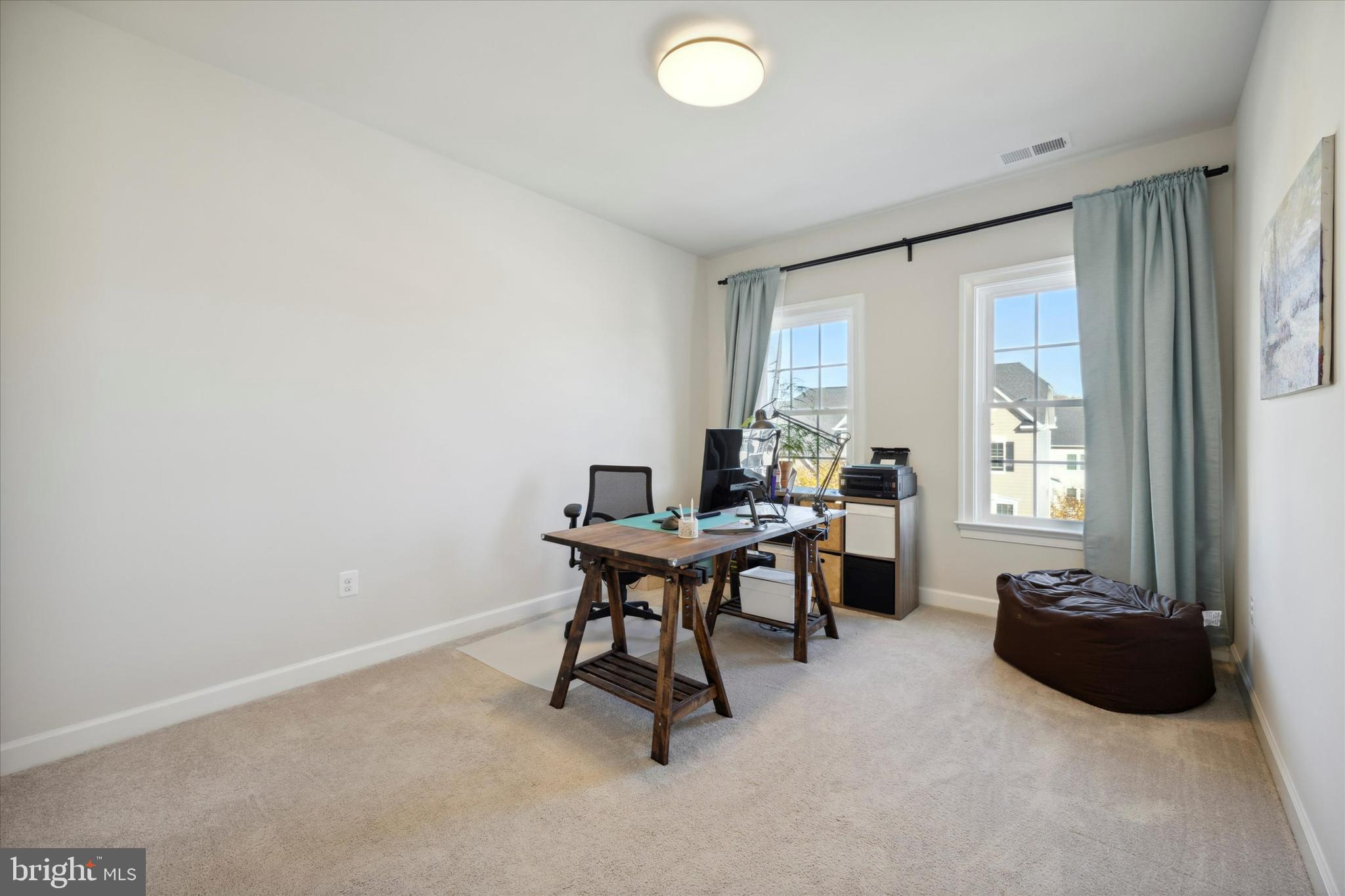 831 Stonecliffe Road Malvern, PA 19355 - Photo 21 of 32 a workspace with furniture and a window