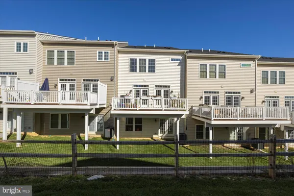 a front view of a residential apartment building with a yard