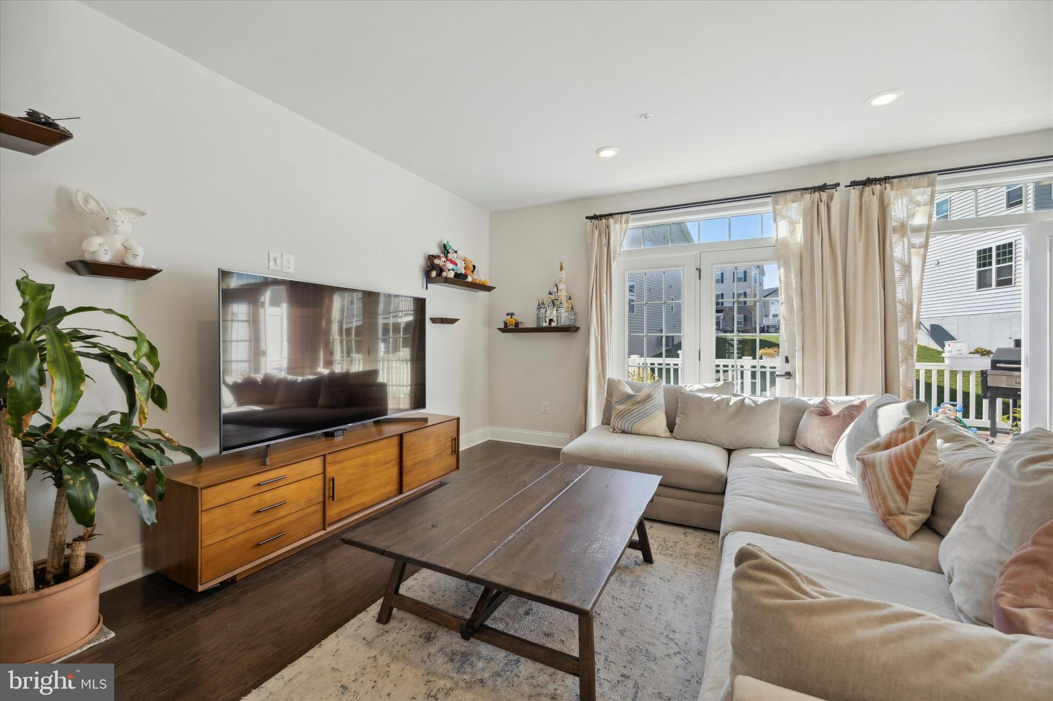 831 Stonecliffe Road Malvern, PA 19355 - Photo 9 of 32 a living room with furniture and a flat screen tv