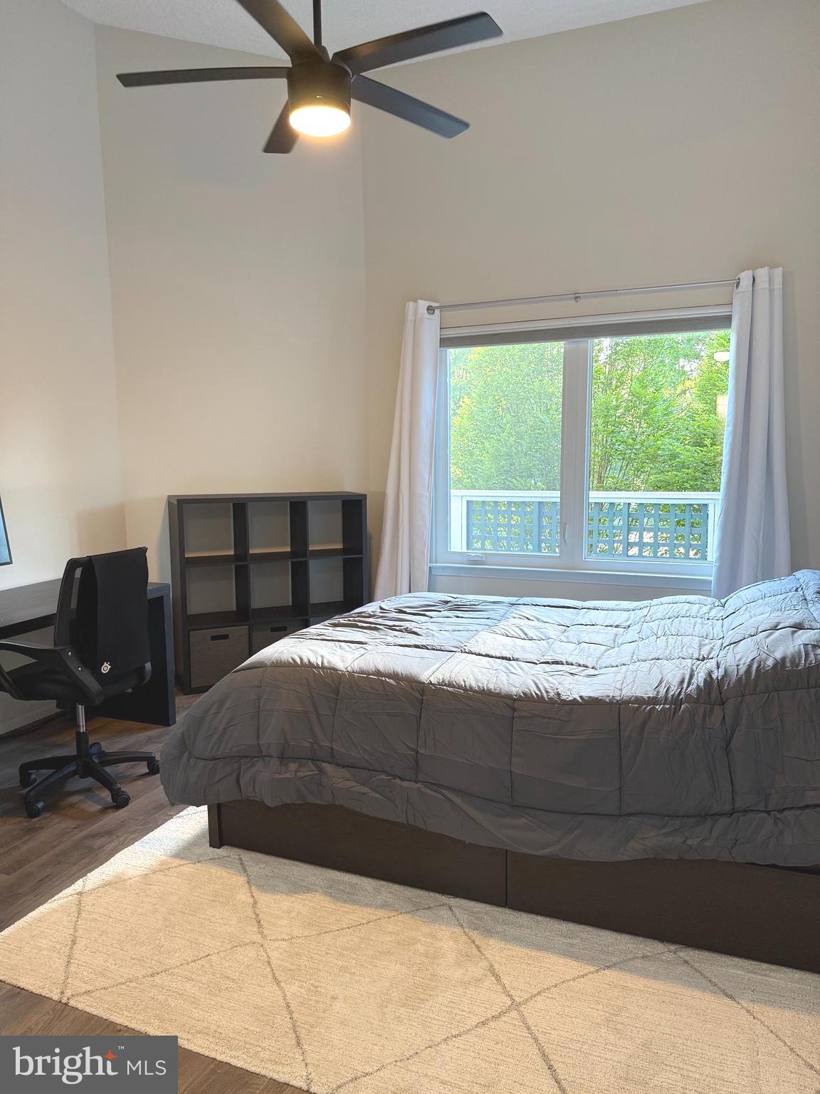 11743 Summerchase Circle, Unit B Reston, VA 20194 - Photo 10 of 25 a bedroom with a bed window and a table