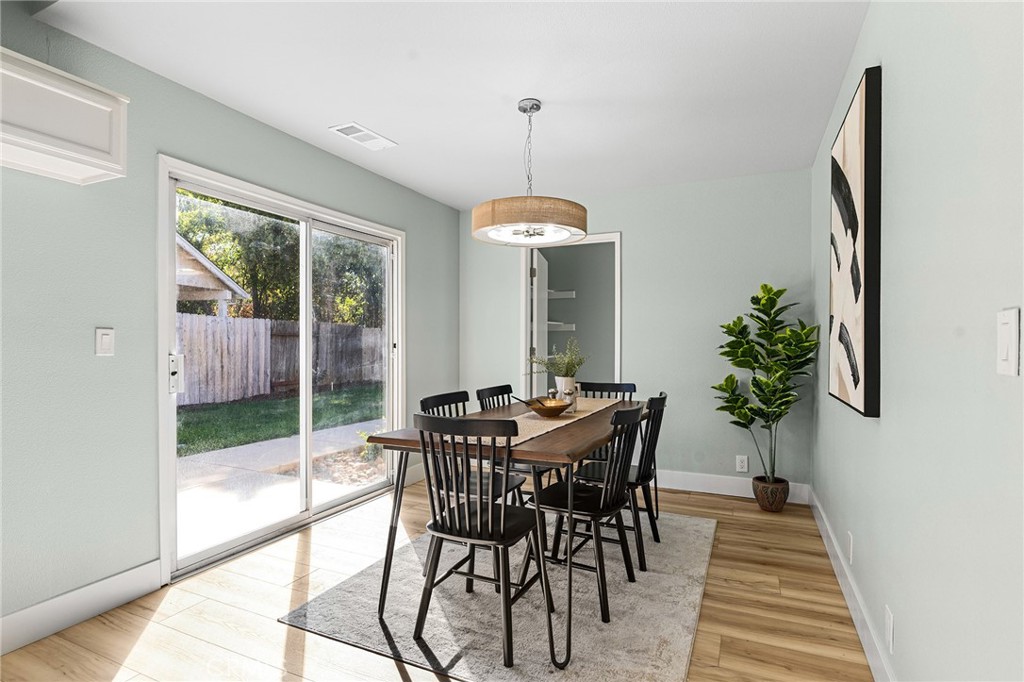 1572 Arch Way Chico, CA 95973 - Photo 12 of 43 a view of a dining room with furniture window and wooden floor