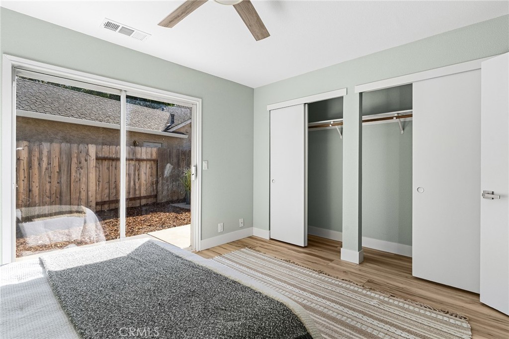 1572 Arch Way Chico, CA 95973 - Photo 15 of 43 a bedroom with a bed and wooden floor