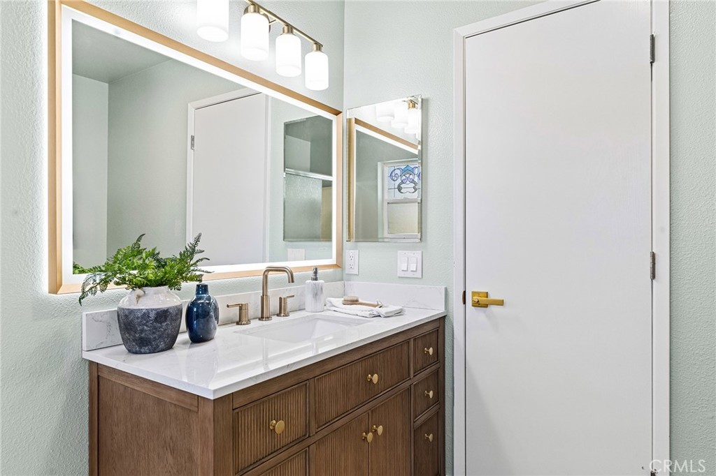 1572 Arch Way Chico, CA 95973 - Photo 17 of 43 a bathroom with a sink and a mirror