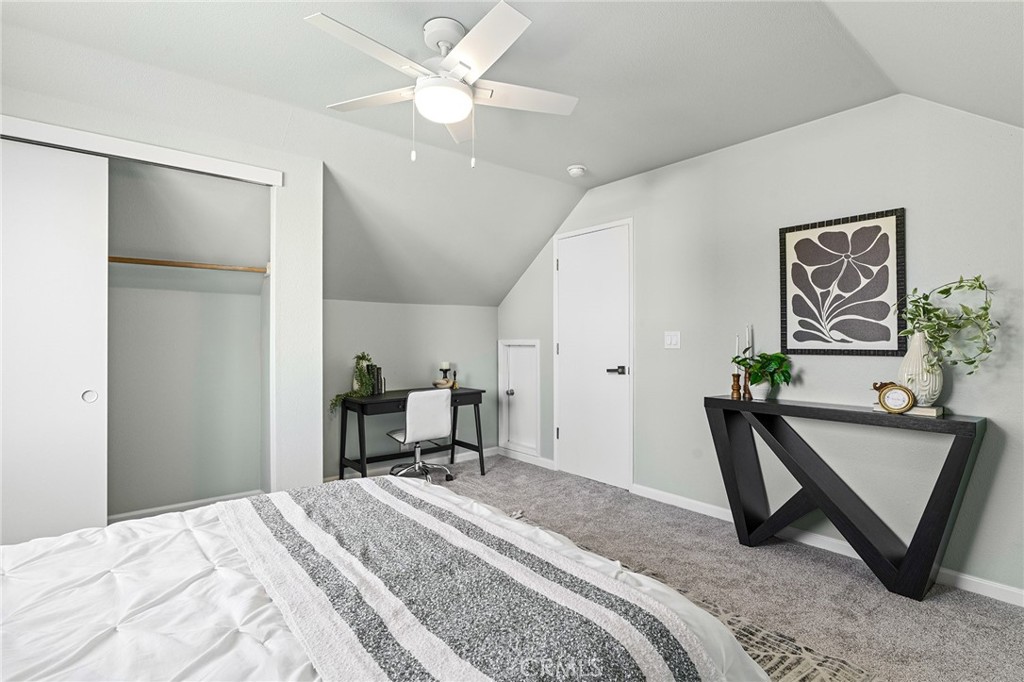 1572 Arch Way Chico, CA 95973 - Photo 28 of 43 a bedroom with a bed and a chandelier