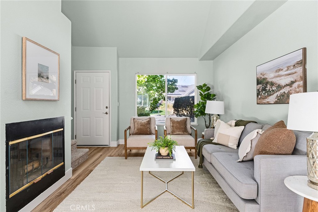 1572 Arch Way Chico, CA 95973 - Photo 4 of 43 a living room with furniture and a fireplace