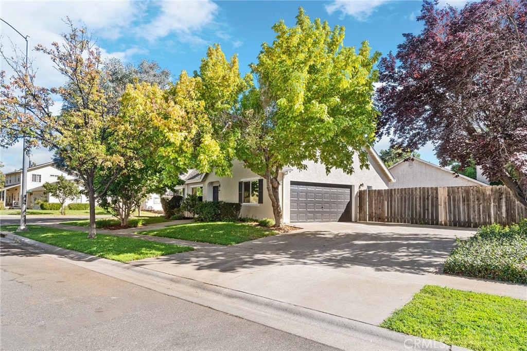 1572 Arch Way Chico, CA 95973 - Photo 43 of 43 a front view of a house with a yard and a garage