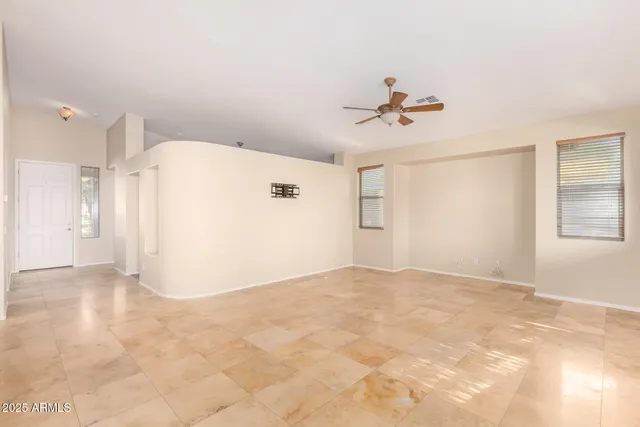 a view of a big room with carpet