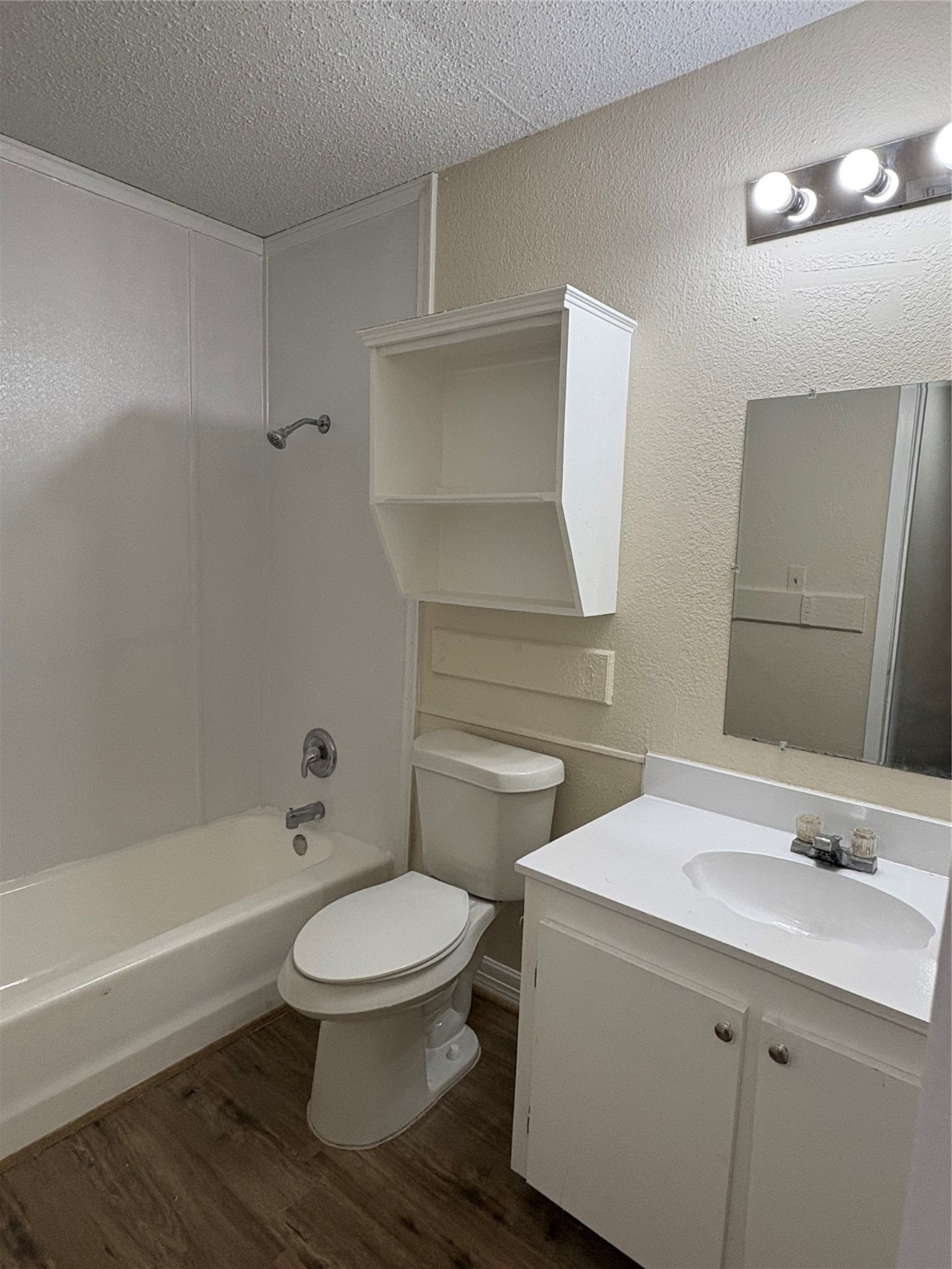 101 East Hospital Drive, Unit 10 Angleton, TX 77515 - Photo 8 of 14 a bathroom with a sink toilet and shower