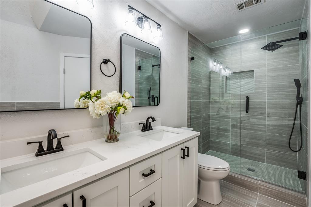6000 Blue Ridge Trail Plano, TX 75023 - Photo 18 of 25 Bathroom featuring a shower stall and double vanity