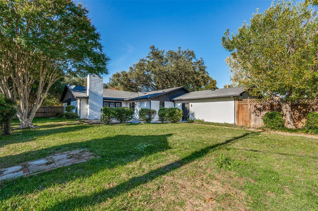 6000 Blue Ridge Trail Plano, TX 75023 - Photo 25 of 25 Mid-century inspired home featuring a chimney and board and batten siding